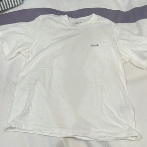 H and M DIVIDED white tee with words “smile”. Women’s size S